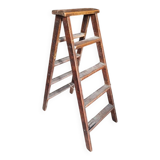 Old wooden stepladder shelf decoration