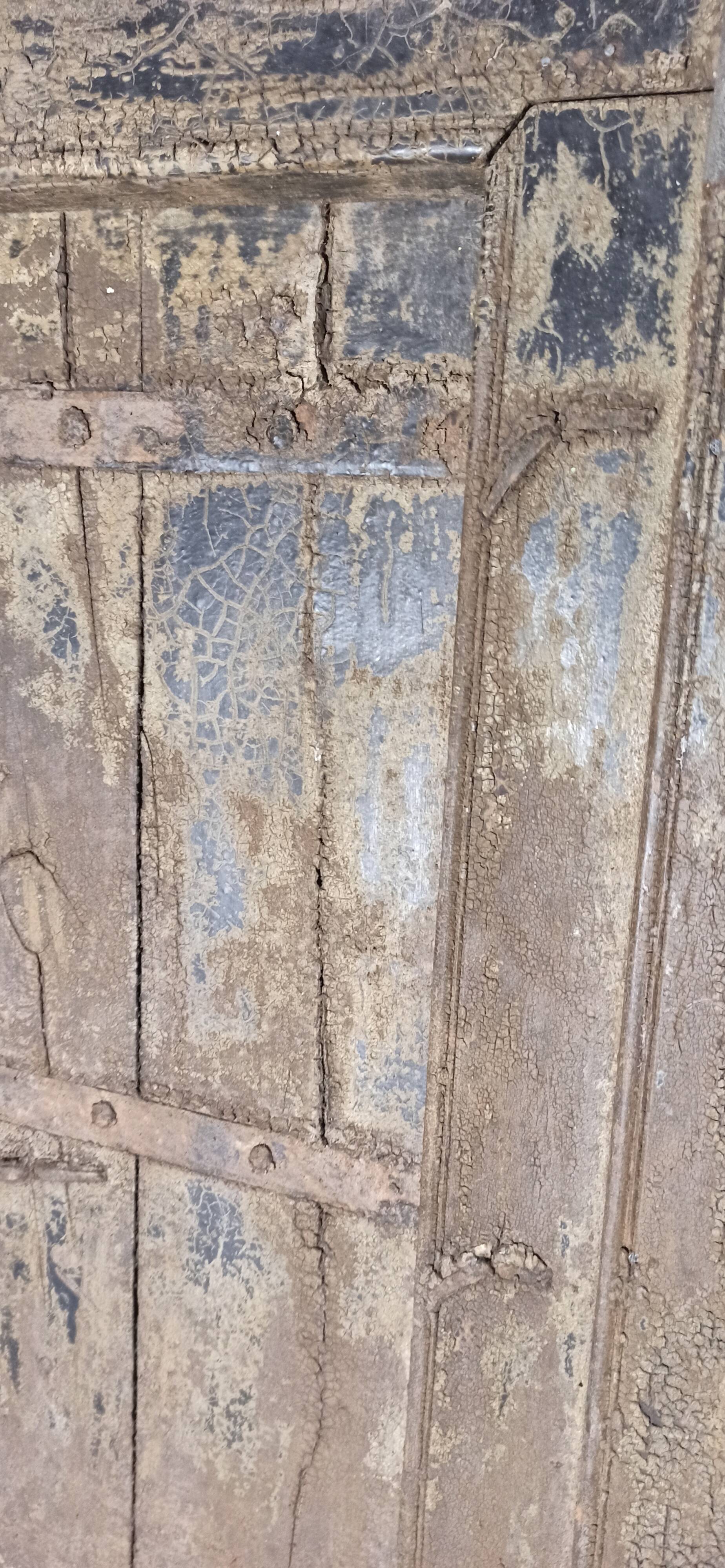 Old wooden door with frame