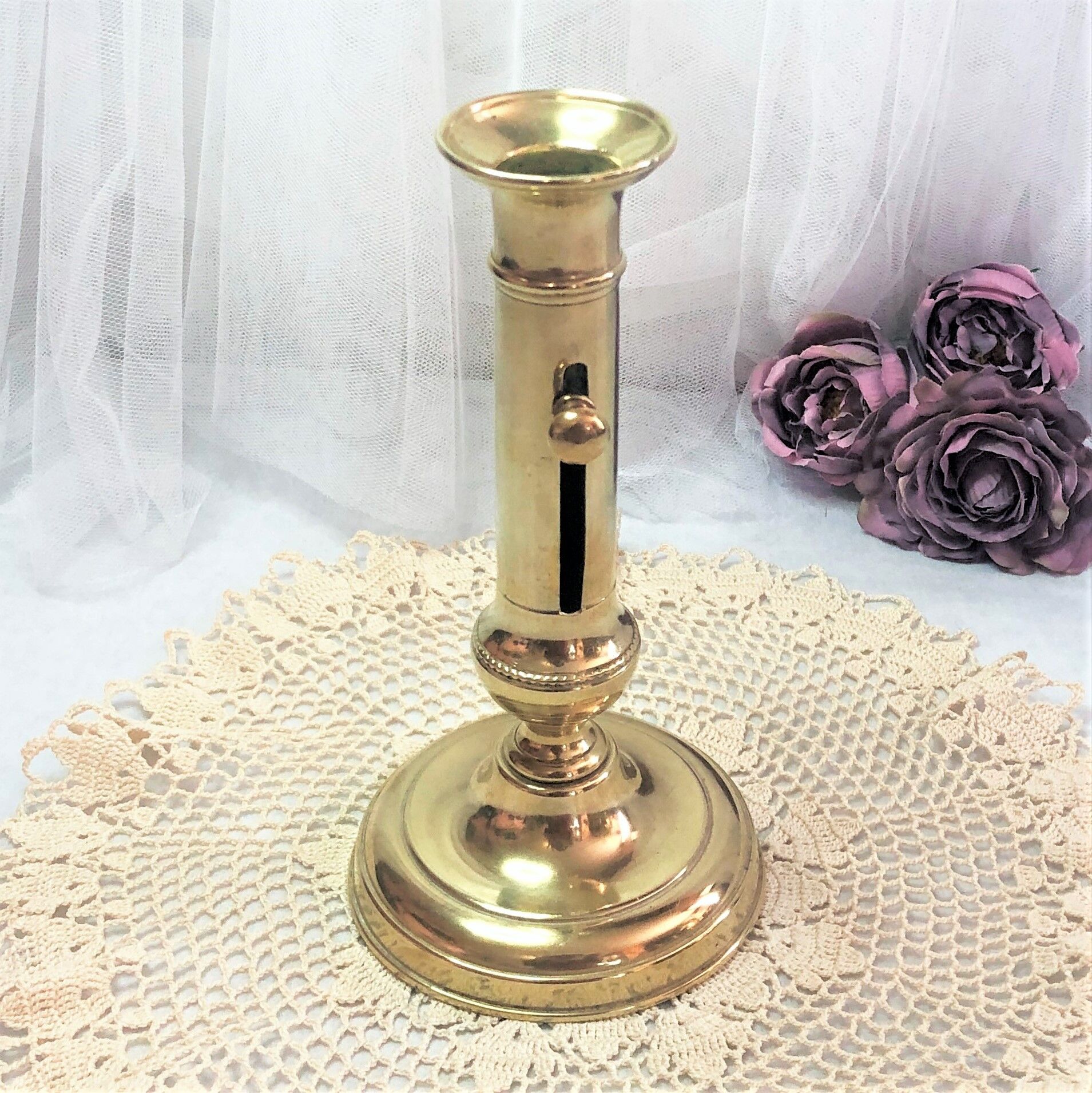 Gilded copper push candle holder