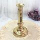 Gilded copper push candle holder