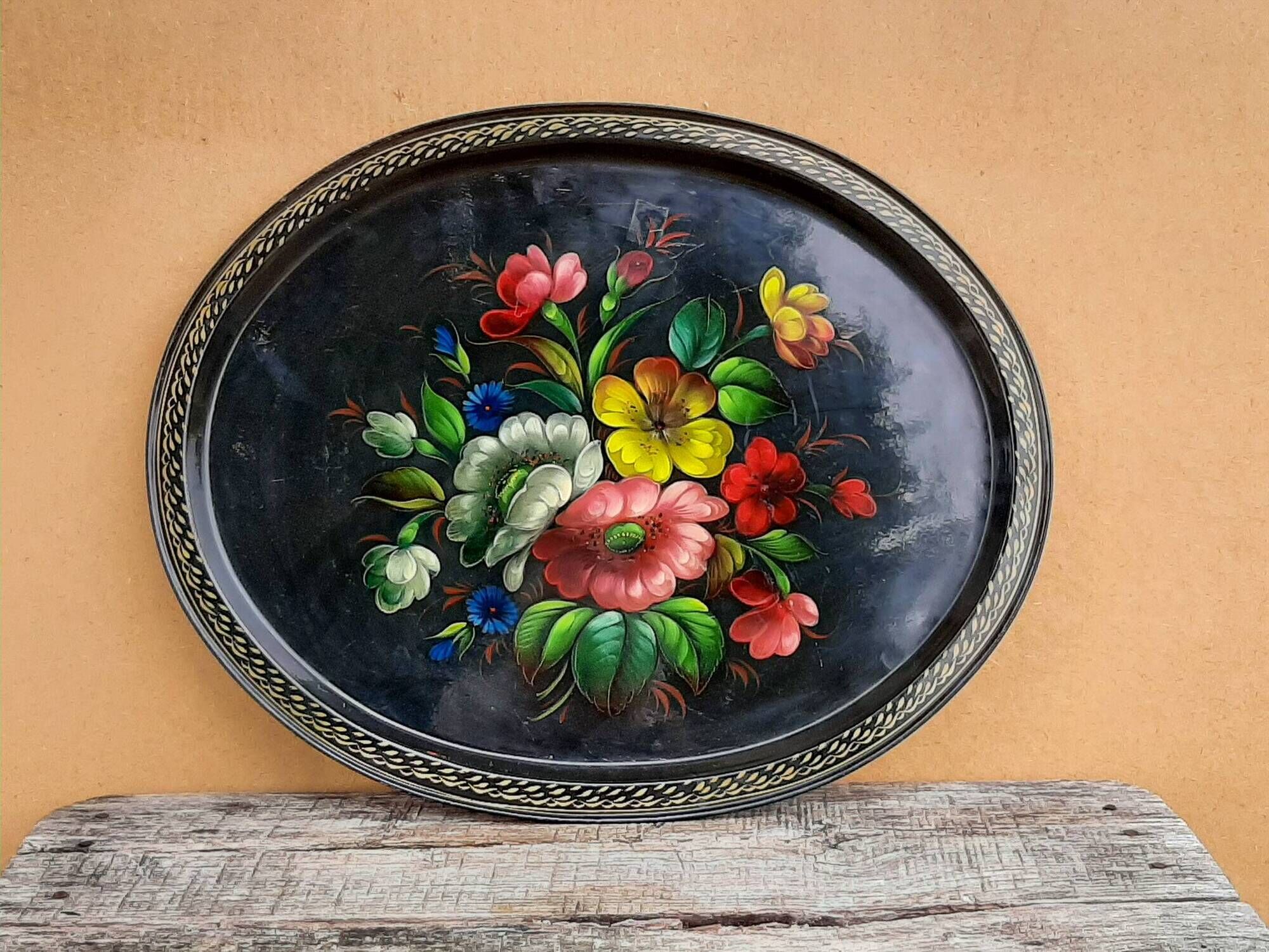Black lacquered metal tray with multicoloured vintage Russian floral decoration.