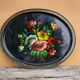 Black lacquered metal tray with multicoloured vintage Russian floral decoration.