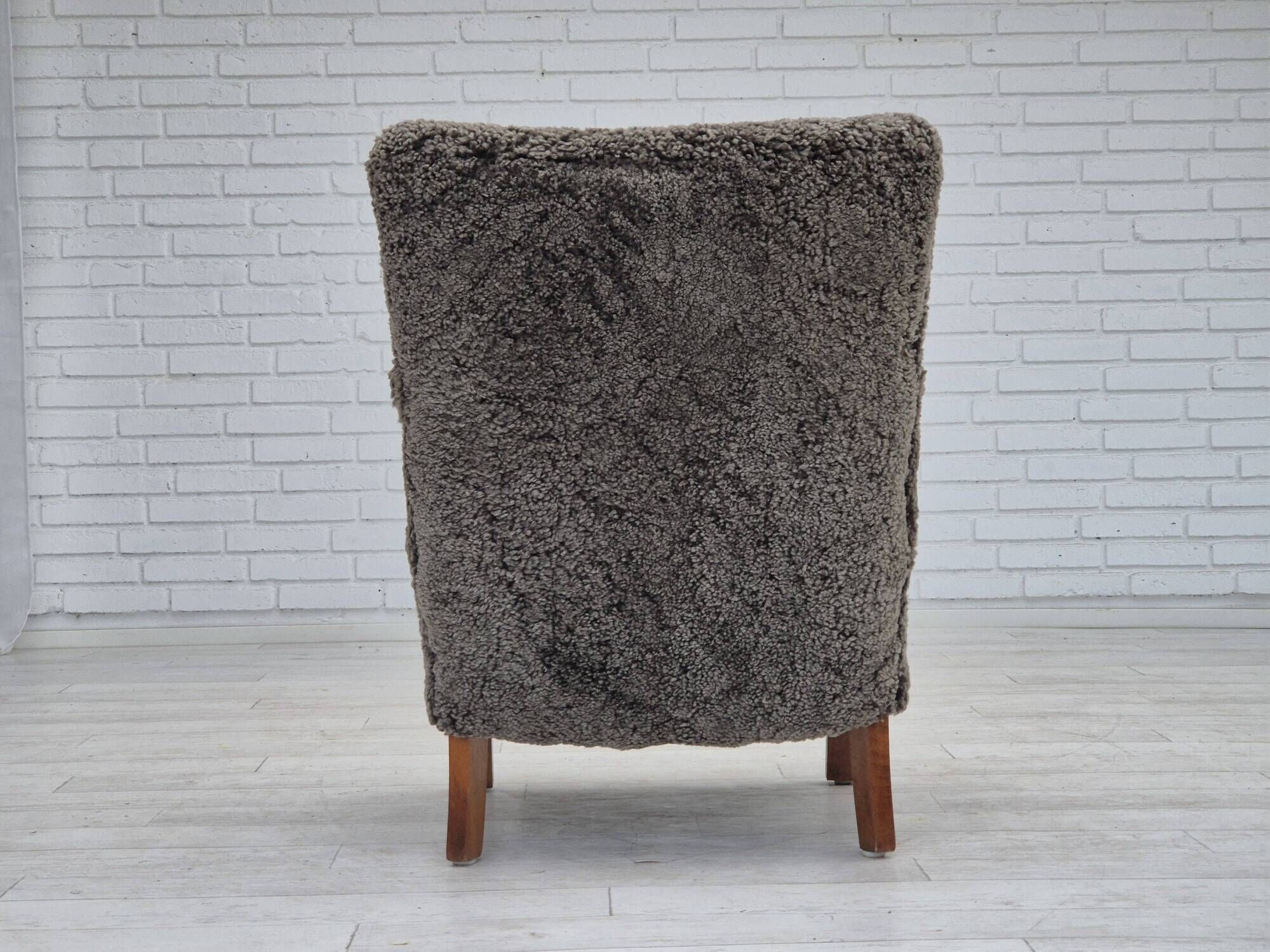 1960s, completely reupholstered Danish art deco armchair, genuine sheepskin "Wellington".