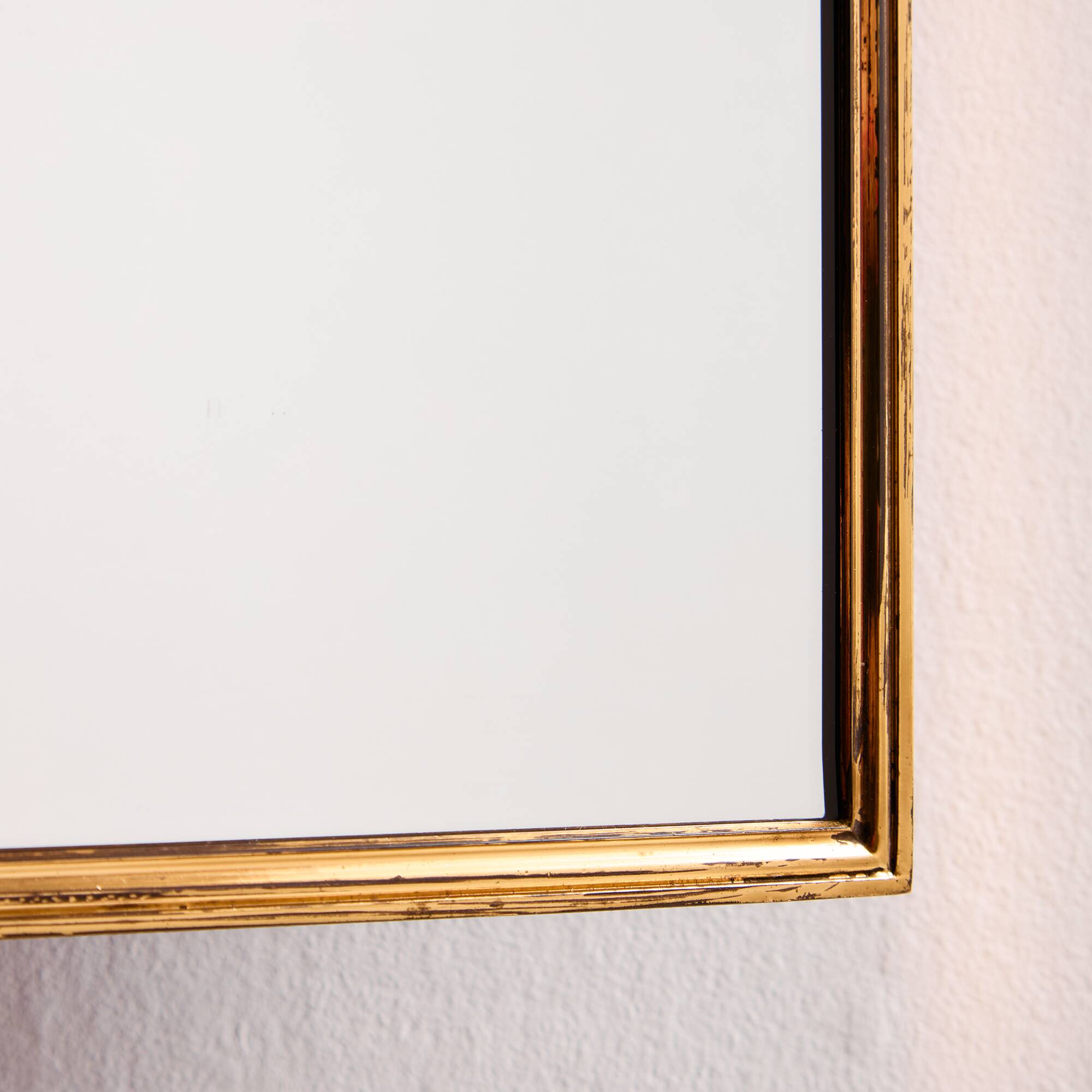 Metal and brass framed mirror