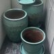 Set of 3 large blue glazed stoneware pots.