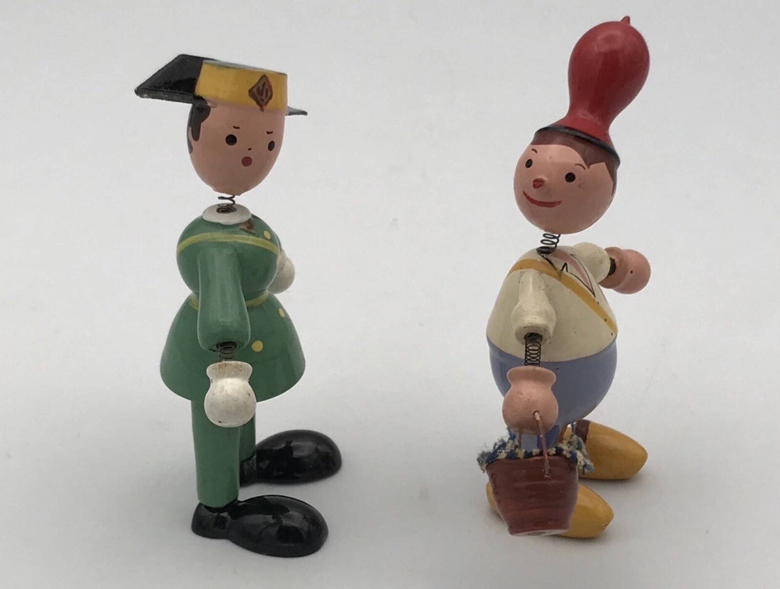 Set of 2 vintage GOULA wooden toy figurines with spring.