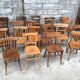 Set of 15 mismatched curved wood bistro chairs
