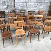Set of 15 mismatched curved wood bistro chairs