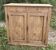 Small Parisian buffet with 2 doors and 2 drawers in light wood.