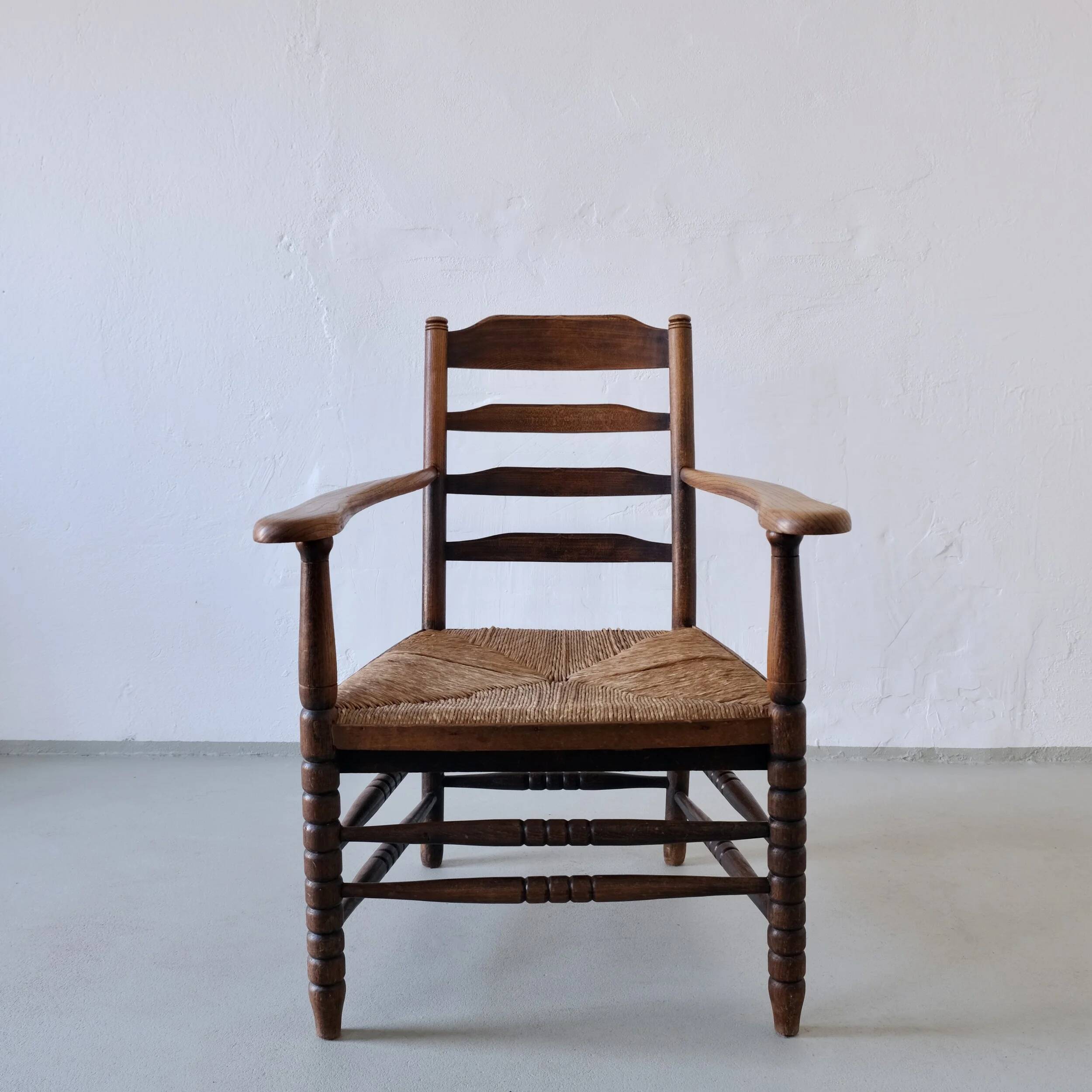 Rustic bobbin rush seat low armchair | Netherlands | 1940s