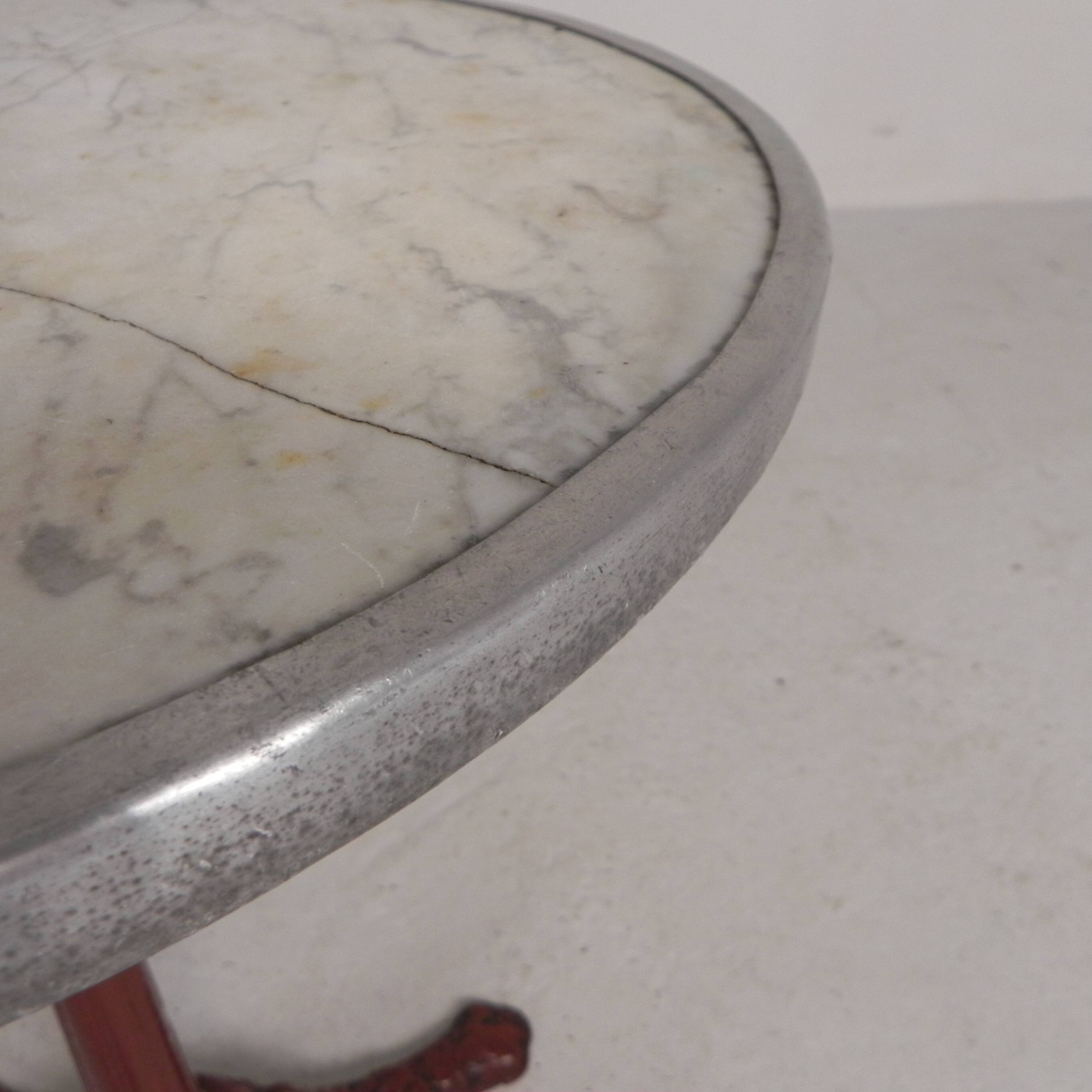 Bistro table with cast iron legs and marble top, 1920s.