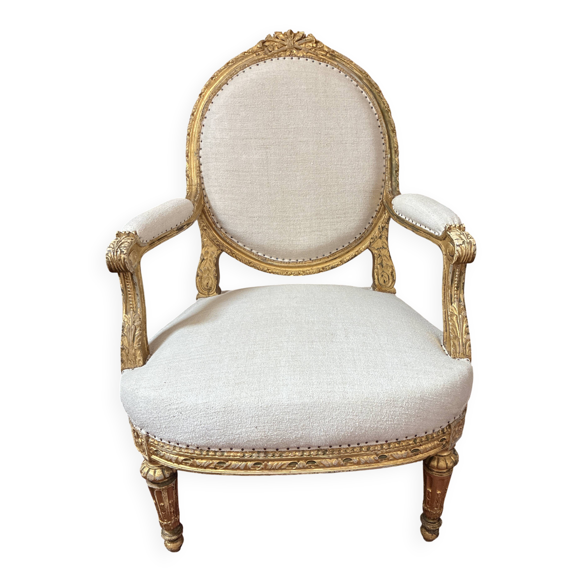 Large cabriolet armchair in Louis XVI style with gilded wood.