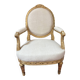 Large cabriolet armchair in Louis XVI style with gilded wood.