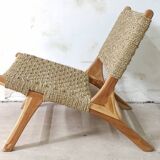 Pair of low armchairs in wood and woven rattan