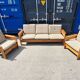 Brutalist-style bench and armchairs in 1970s pine.