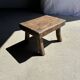Small stool, rectangular solid teak side table with curved legs.