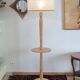 Light wood floor lamp with Art Deco wooden shelf