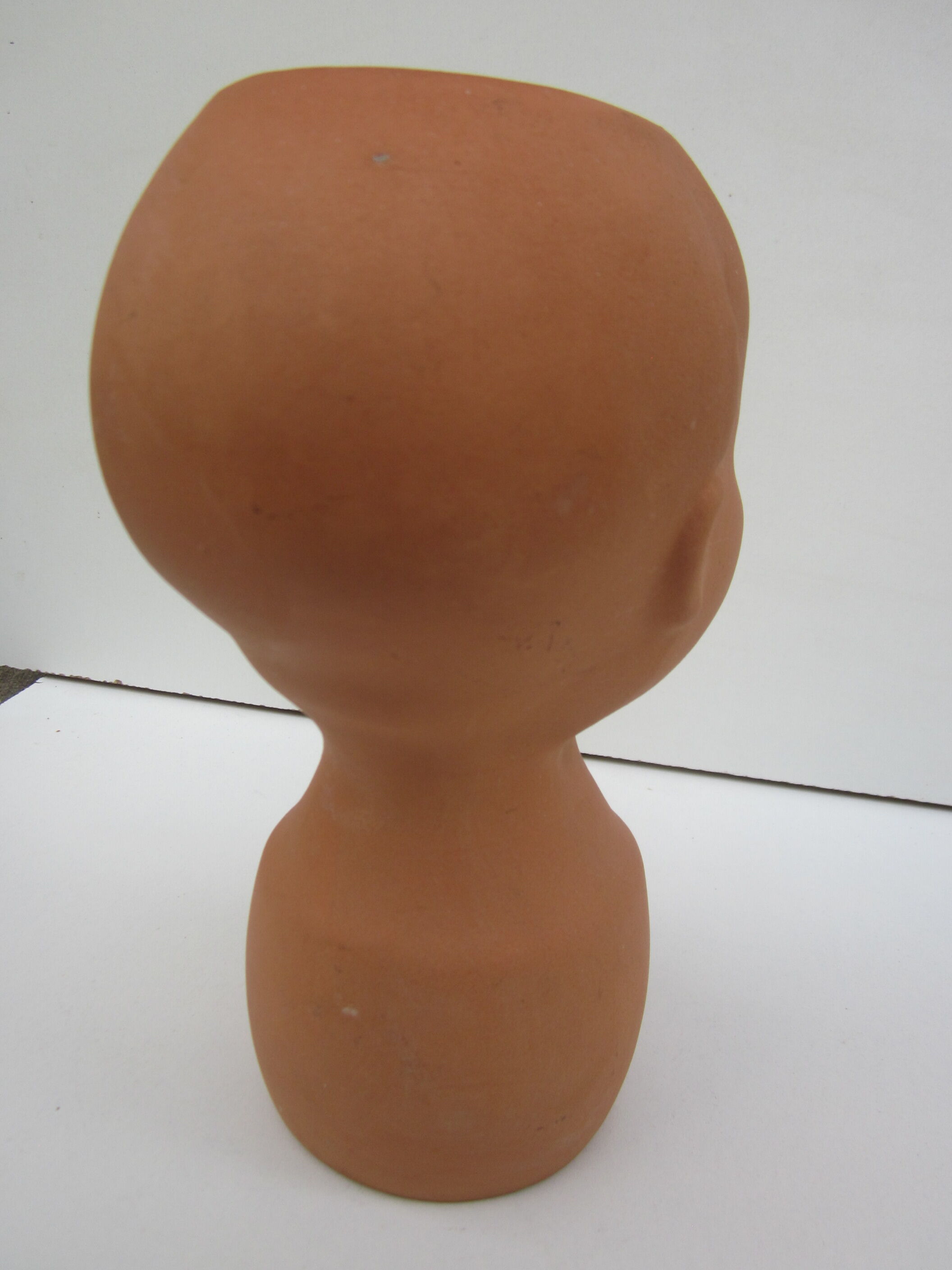 Terracotta vase: child's head