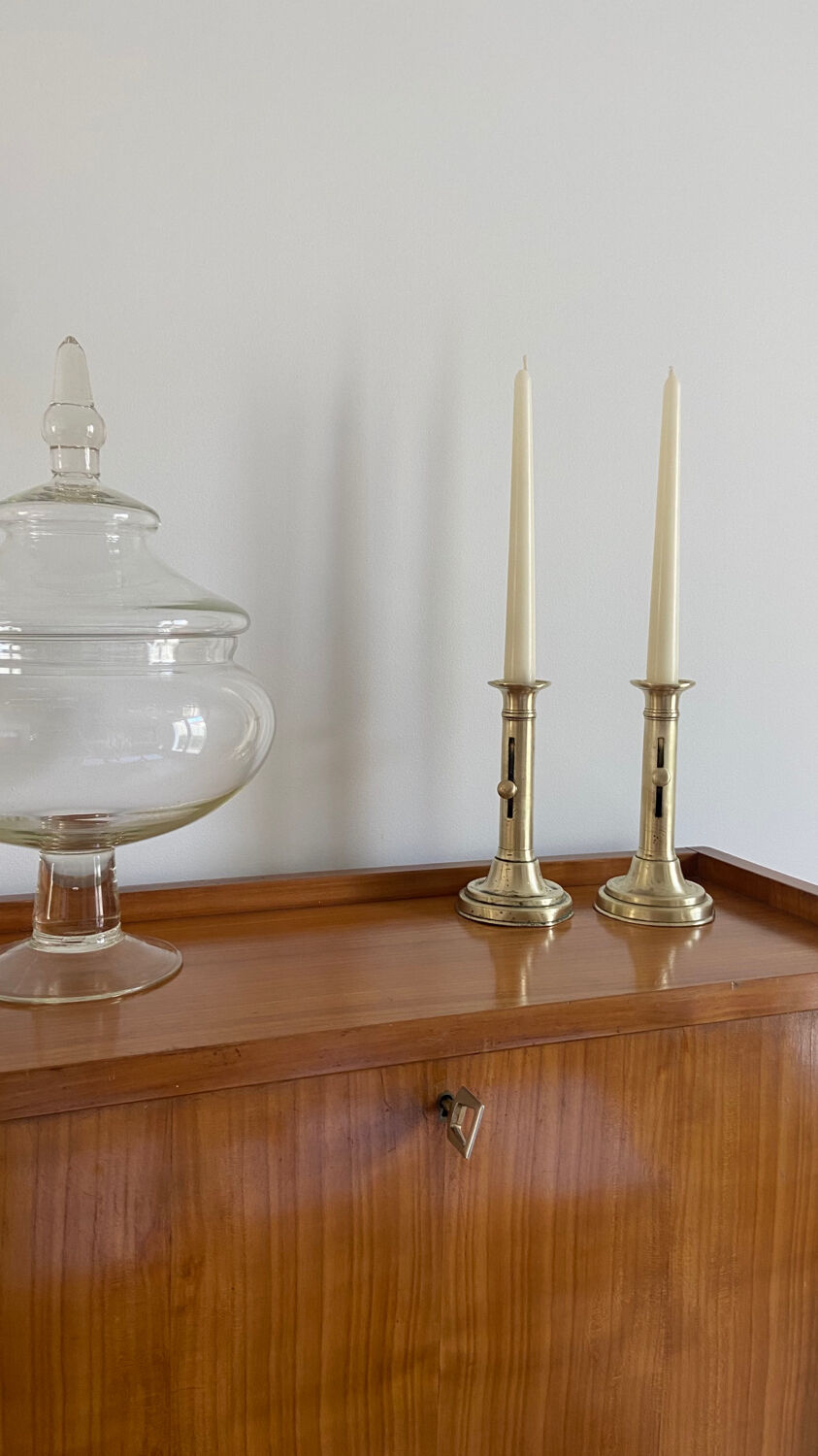 Pair of antique brass push candlesticks
