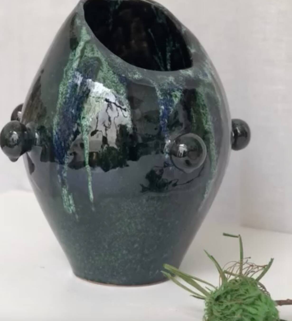 Glazed green and blue ceramic vase.