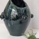 Glazed green and blue ceramic vase.