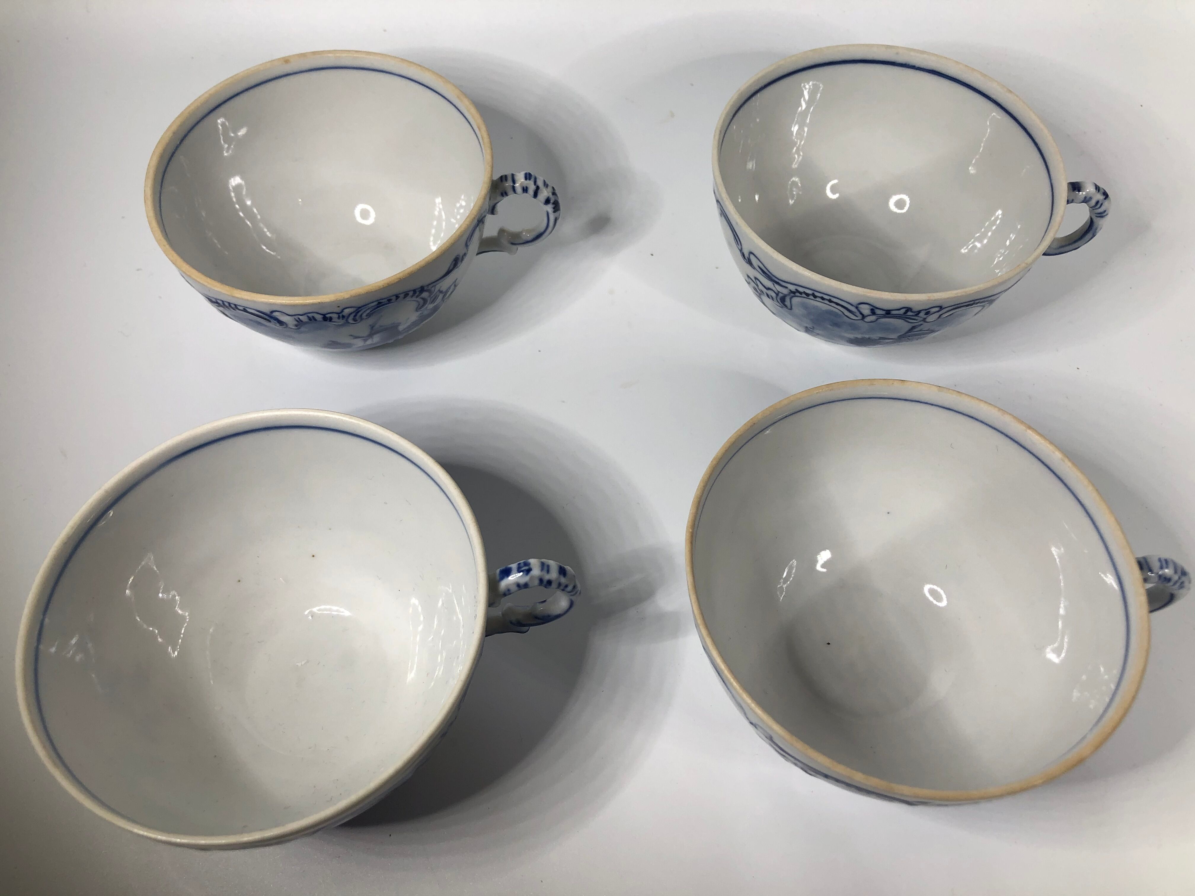 4 old cups and under Rauenstein Delft cups
