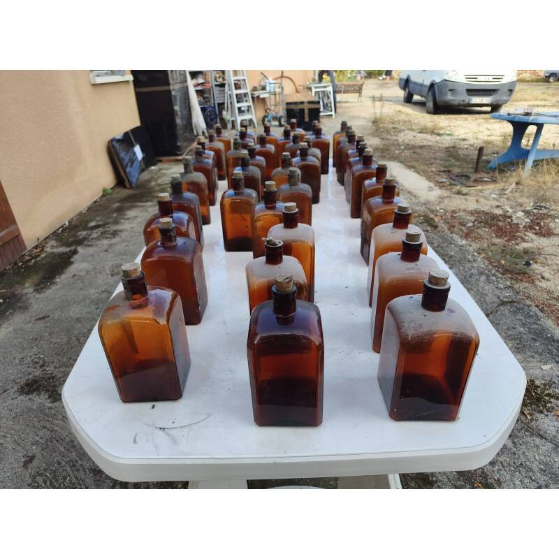 Set of 41 brown glass pharmacy bottles.