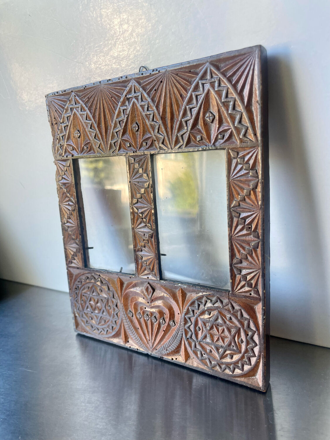 Double frame intricately carved wood