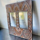 Double frame intricately carved wood