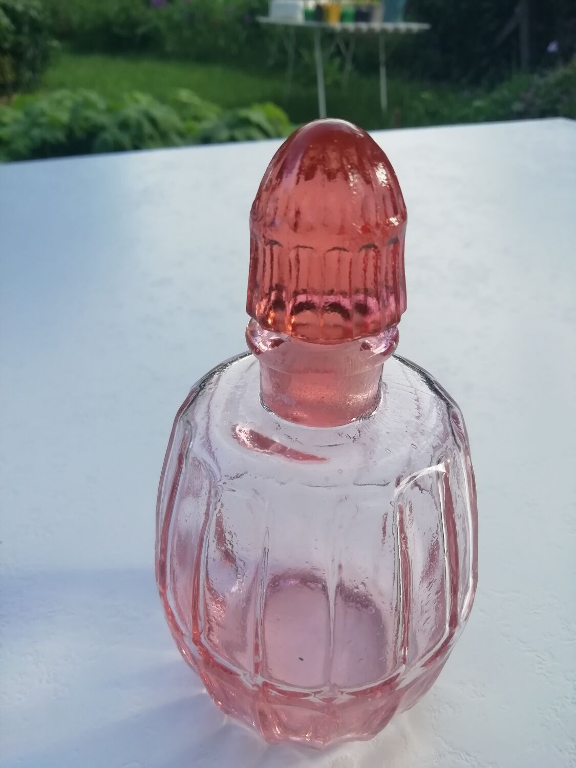 Pink molded glass bottle