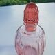 Pink molded glass bottle