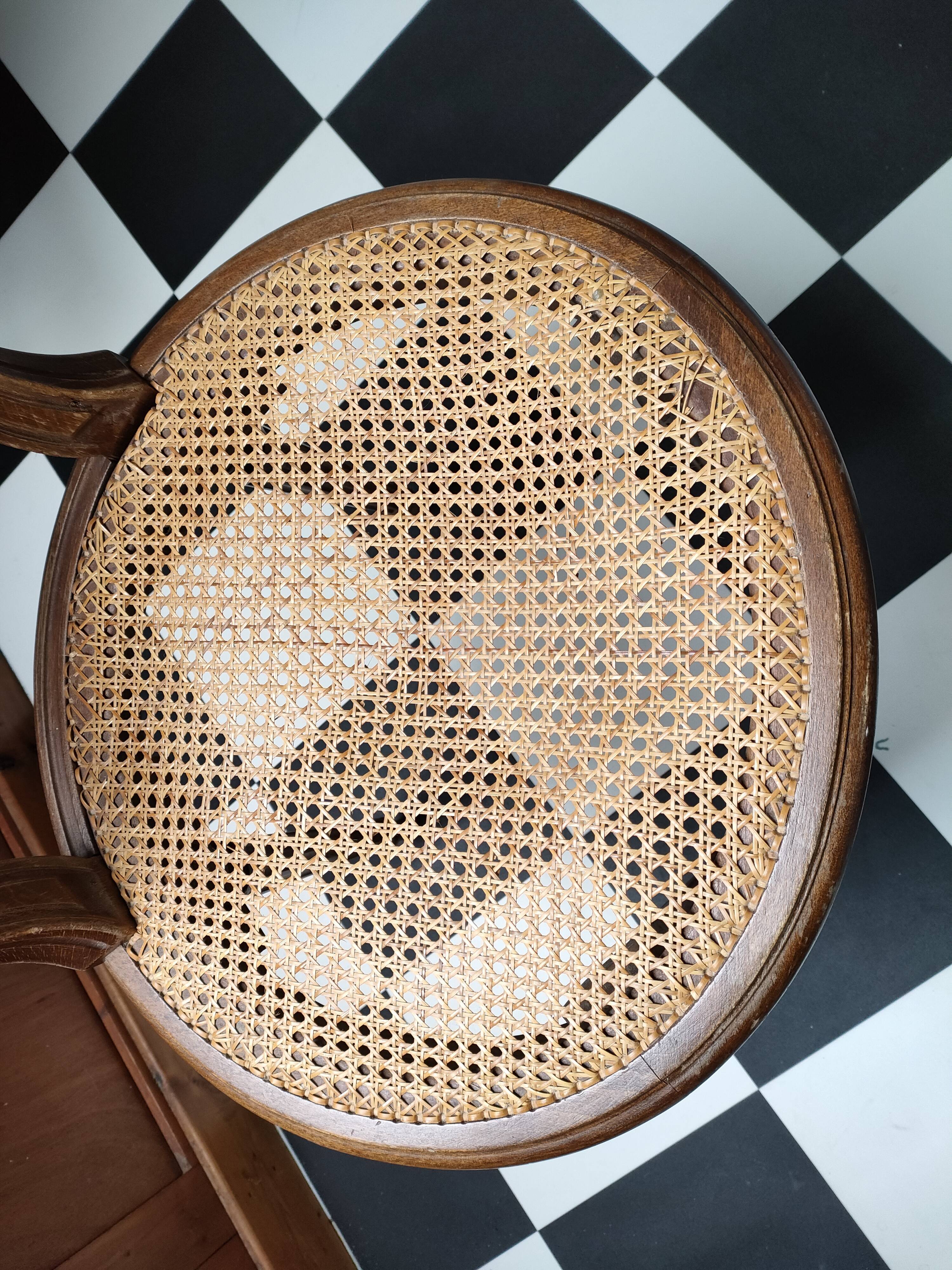 Wooden chair sitting in cannage