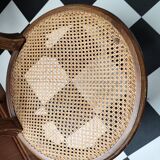 Wooden chair sitting in cannage