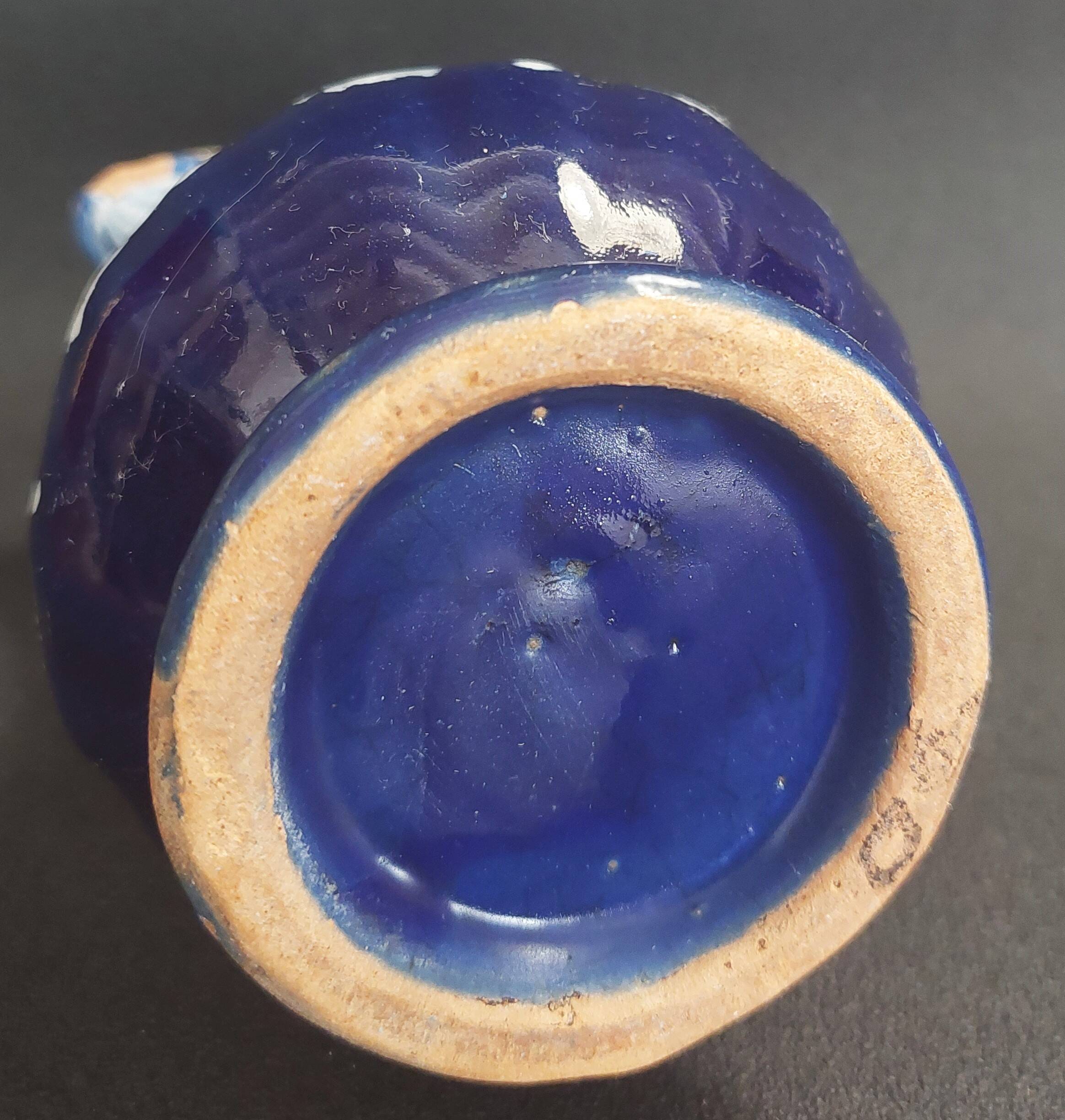 Earthenware pitcher from the North of France with blue covering, 19th century