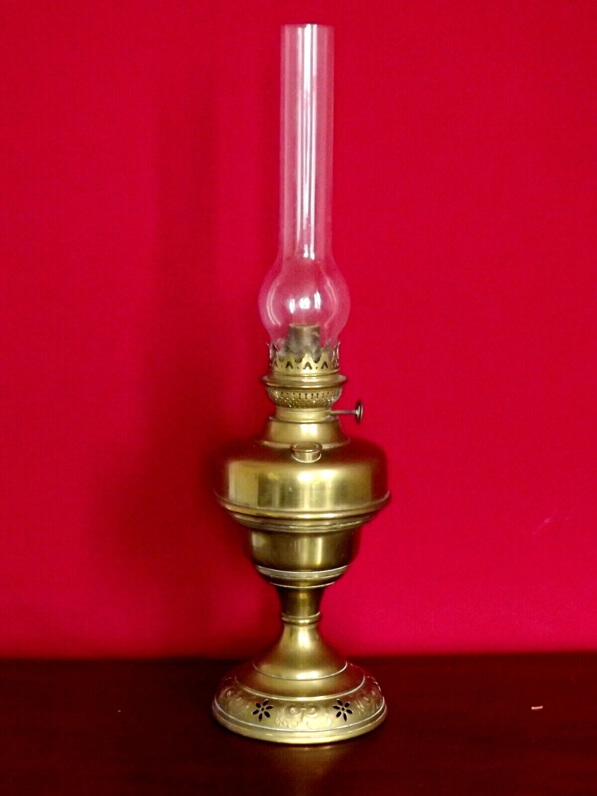 Vintage brass oil lantern with decorative base and transparent glass funnel stamped L B Brand Delay 4399.