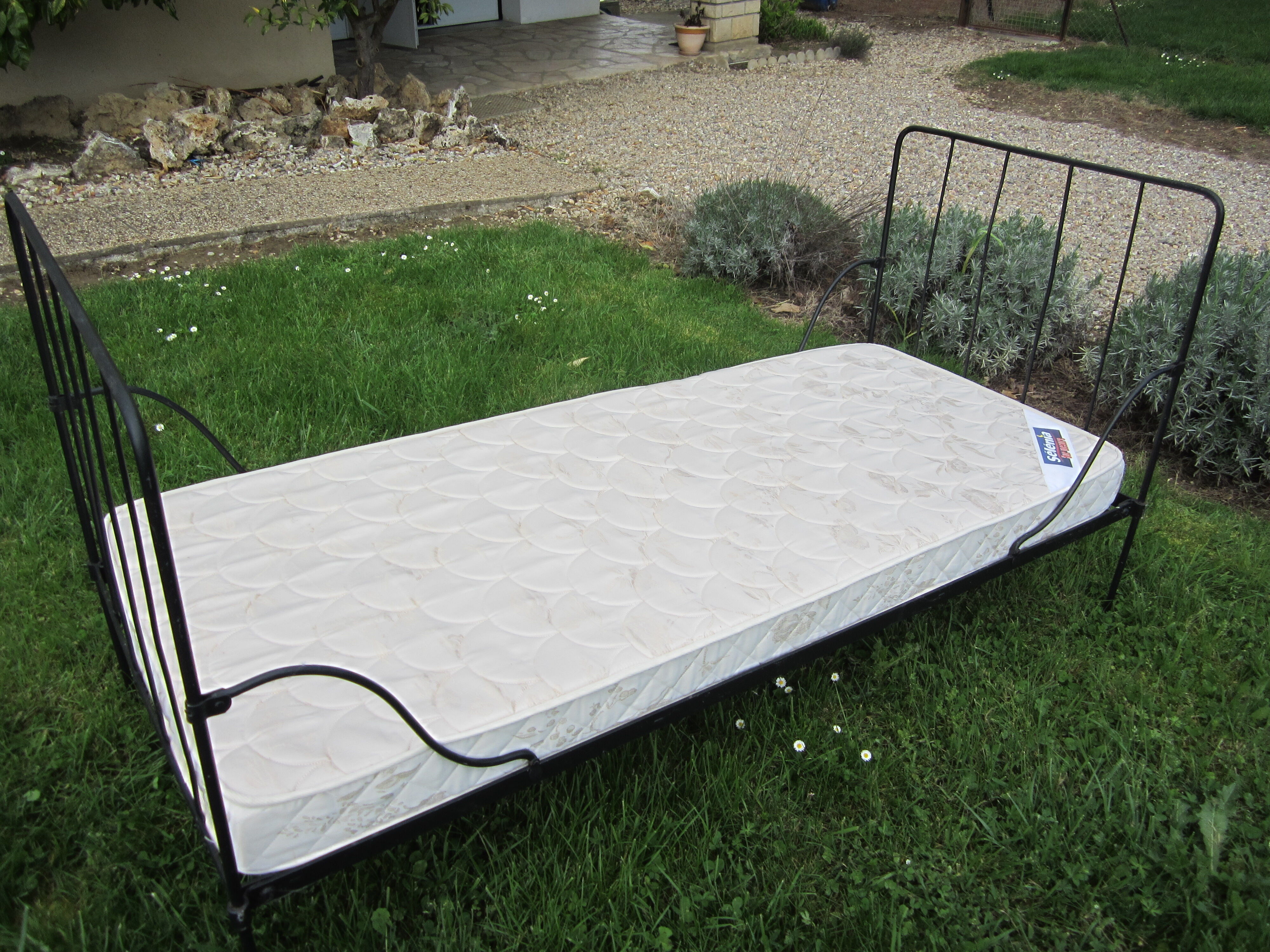 Wrought iron bed with mattress