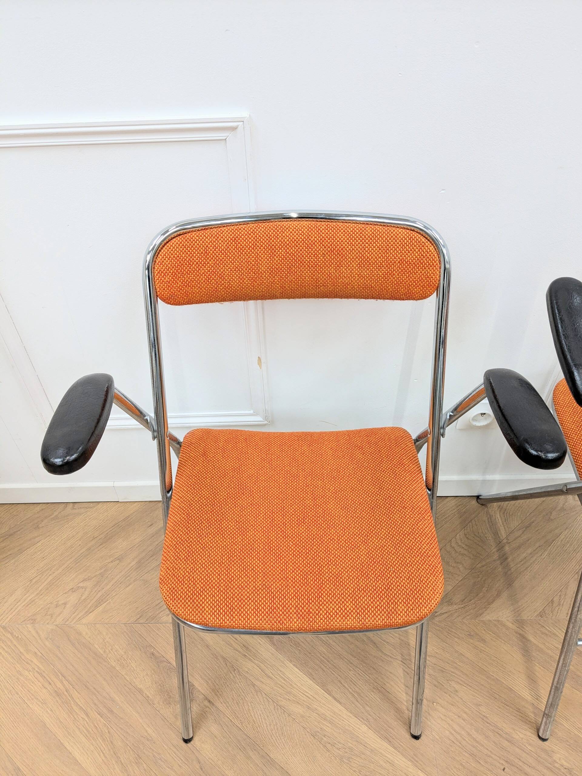 6 orange folding chairs