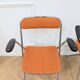 6 orange folding chairs