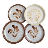 Vintage stoneware dinner plates with hand-painted flower designs.