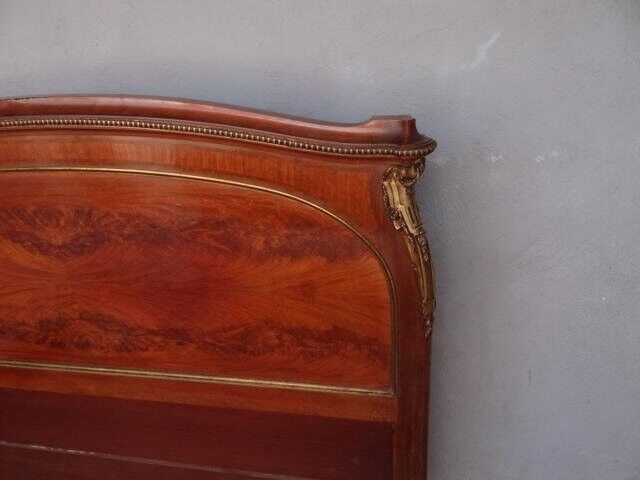Golden bronze Louis XVI style mahogany bed