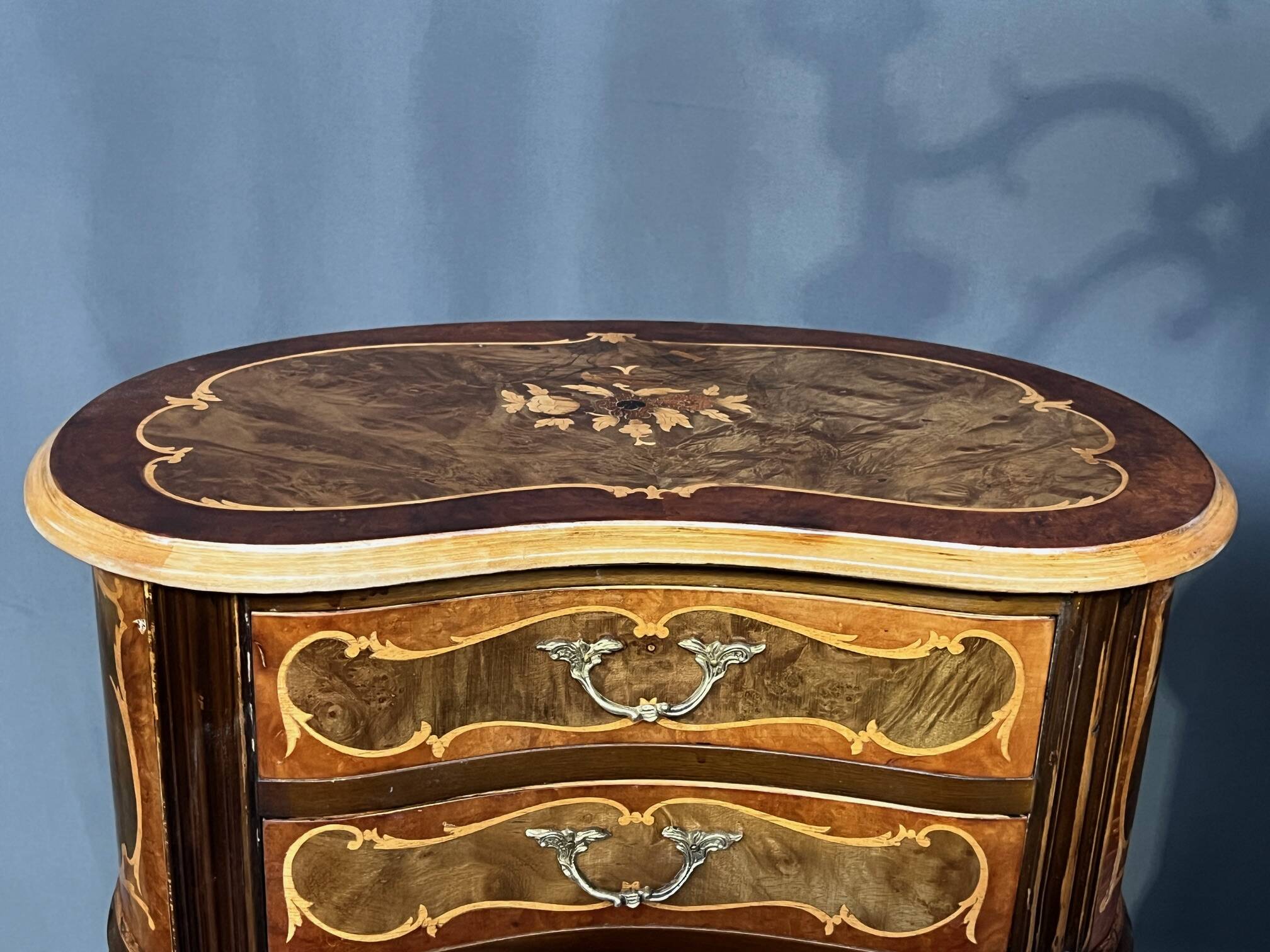 Pair of Rococo-style bedside tables with precious wood marquetry.