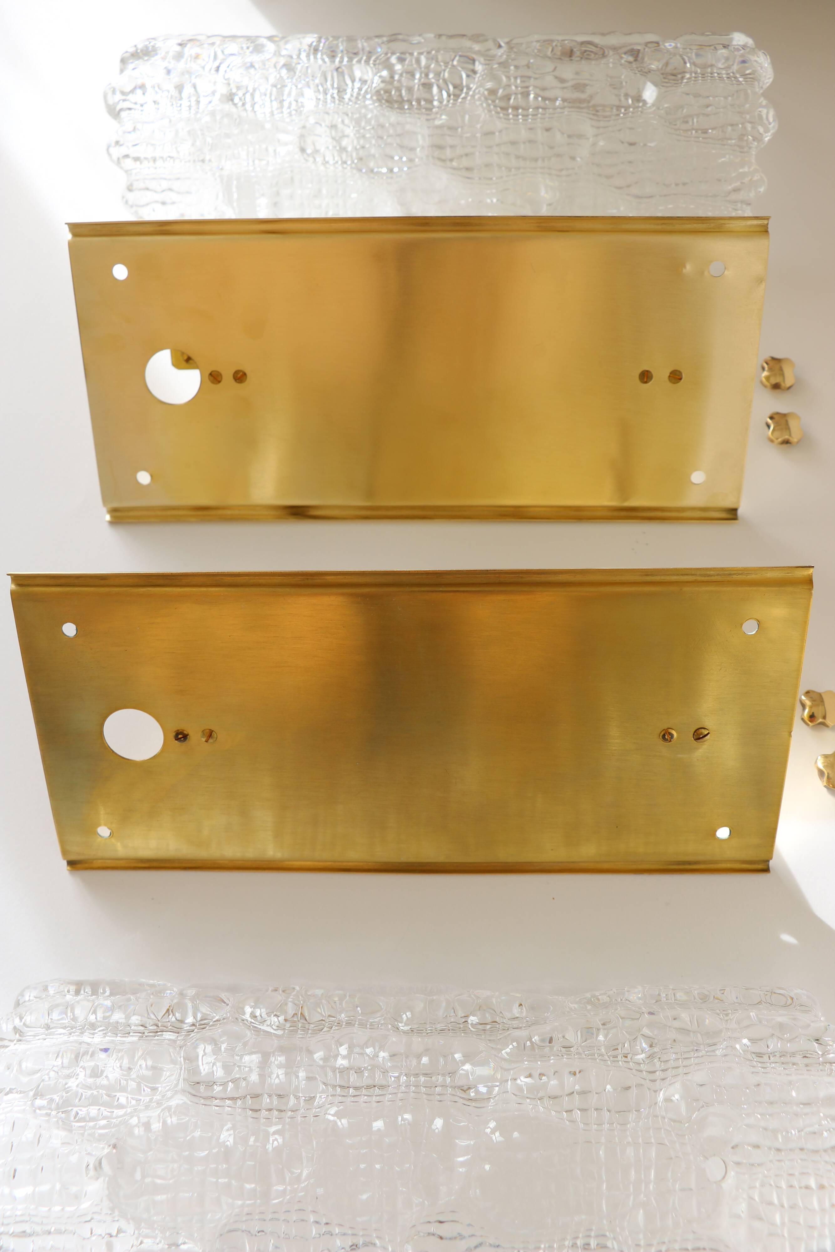 Pair of glass and brass wall lights by Carl Fagerlund for Orrefors, 1960.