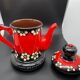Vintage terracotta teapot glazed and hand painted