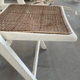 4 folding chairs with wicker seating