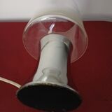 Table lamp, chrome glass stand and transparent glass globe.