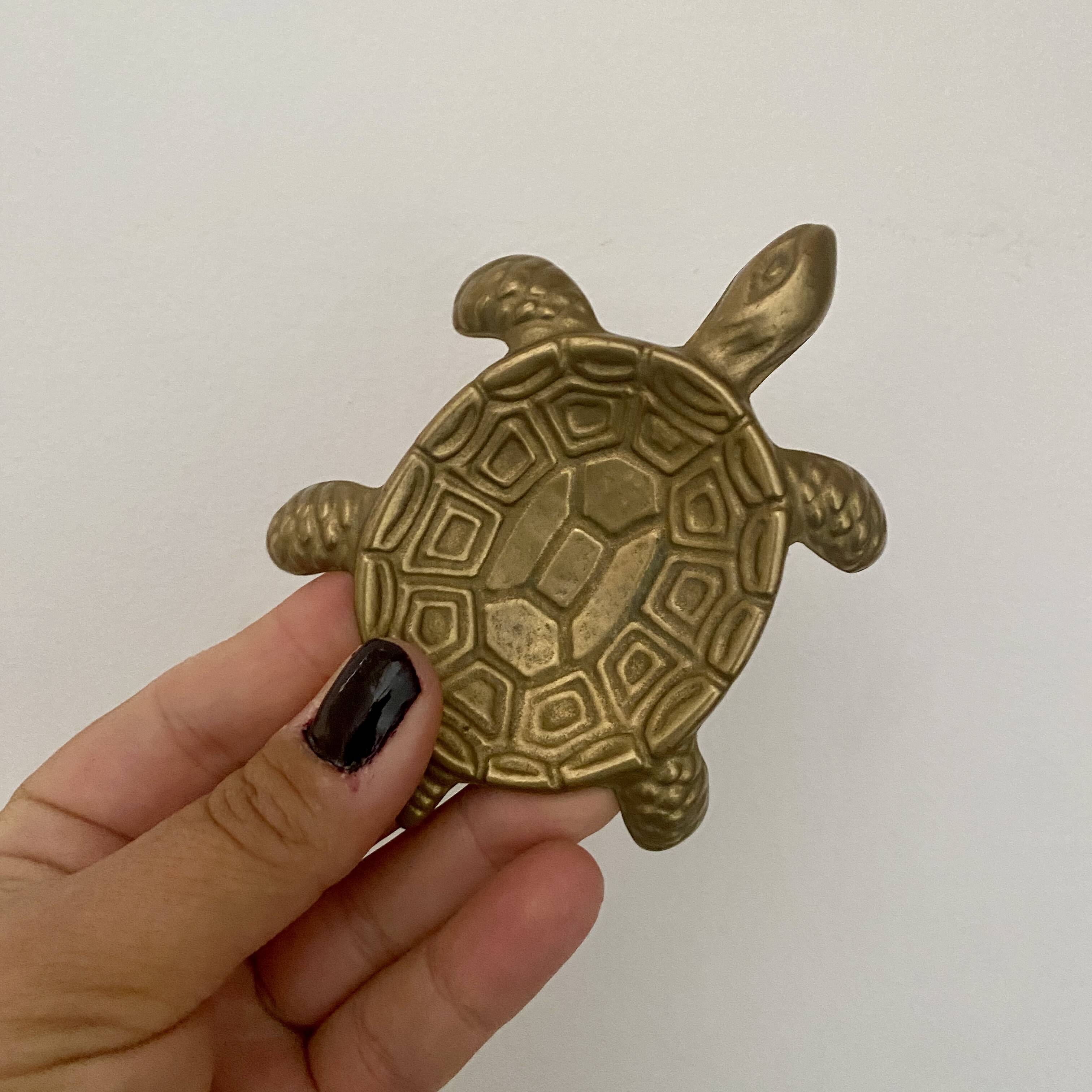 Vintage brass turtle pocket emptier