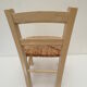 Children's chair of greige color in wood and straw