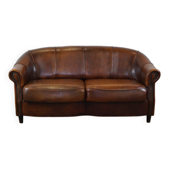 Charming sheepskin leather 2-seater sofa with fixed seat cushions