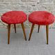 Pair of tripod stools, with tapered wooden feet and moumoute seat