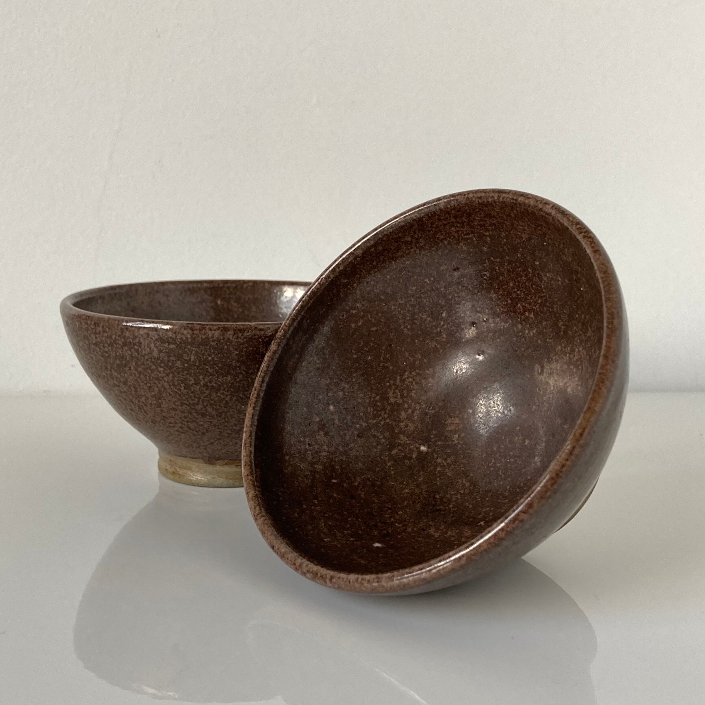 Pair of Japanese temoku bowls in brown glazed stoneware